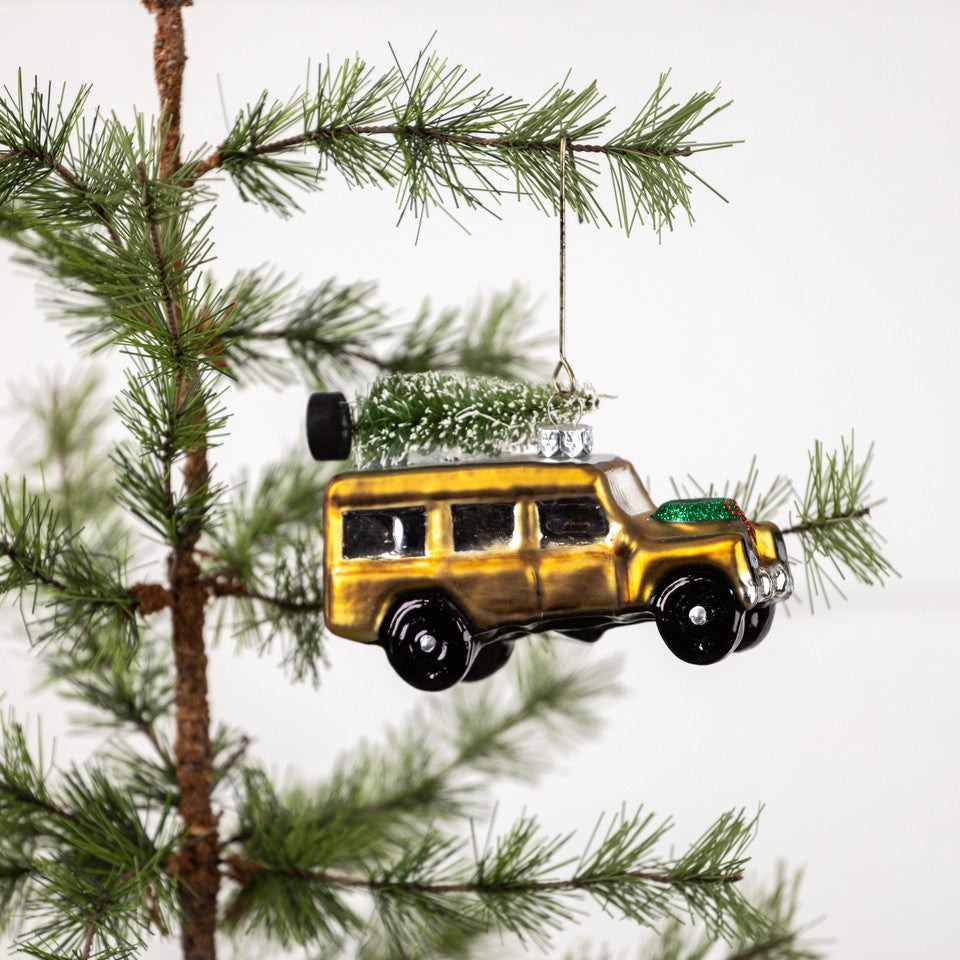 Gold Glass SUV with tree on roof