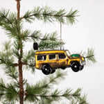 Gold Glass SUV with tree on roof